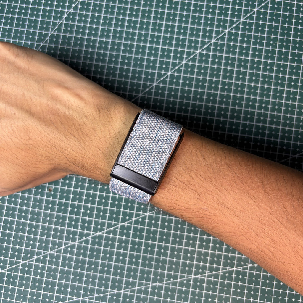 Whoop 4.0 band closed on the wrist with the Helio Strap and V3 Metal Edition adapter
