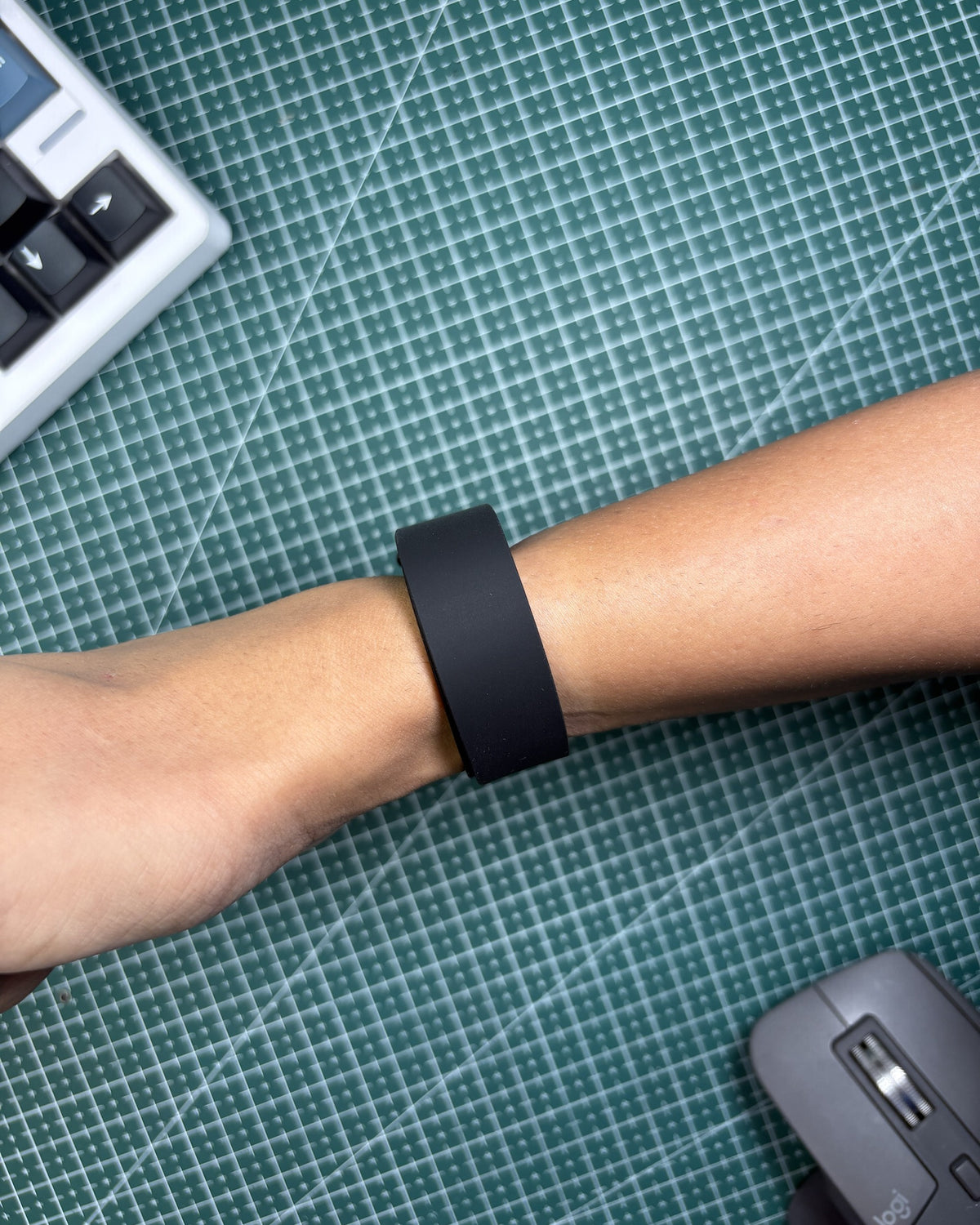 Fitbit Air Elevated Band in Obsidian worn on wrist, top view